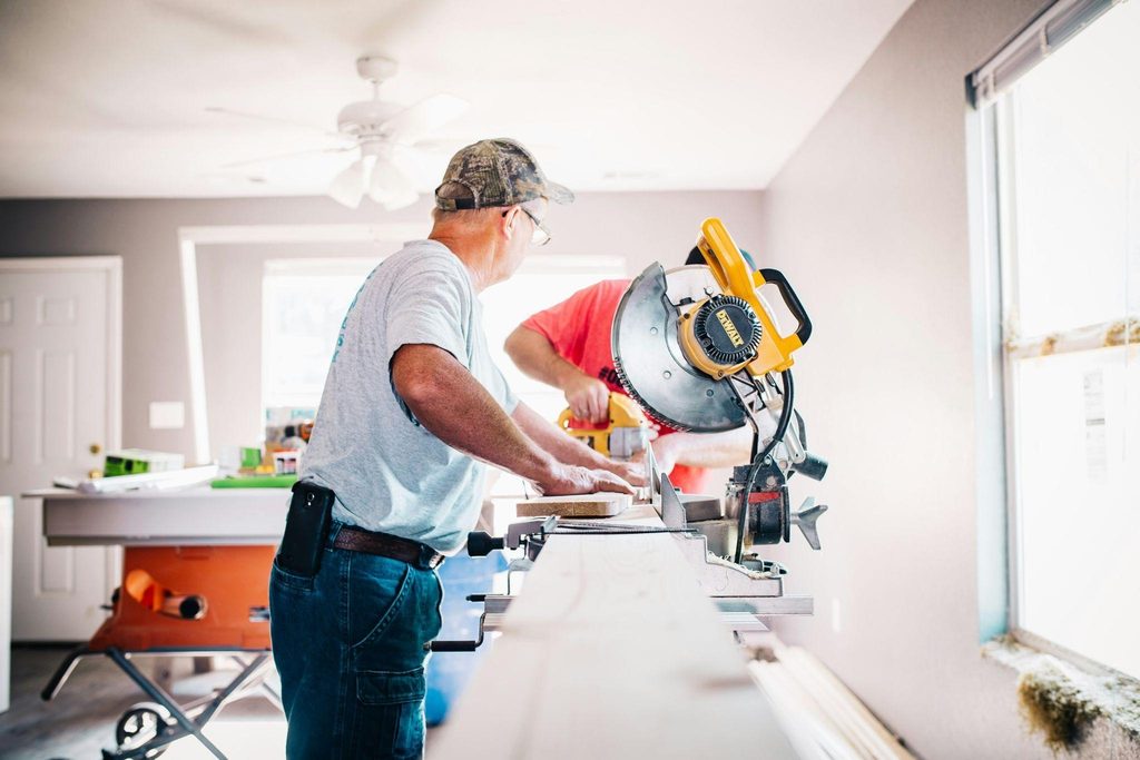 2 men creating a cupboard